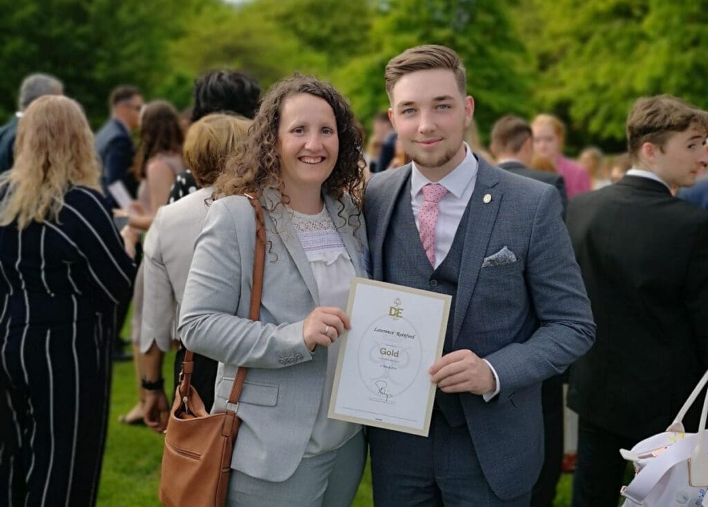 A student receives his Duke of Edinburgh Award certificate.